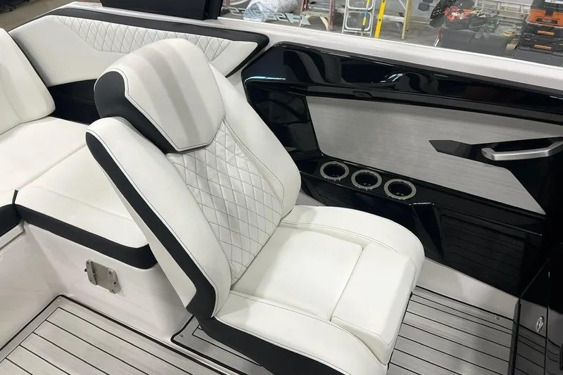 Slide: The Image of 2025 Yamaha Boats 222SE interior with luxurious white seating and modern design. - 8