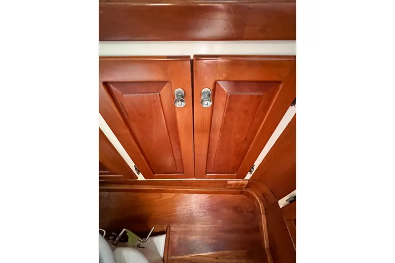Slide: The Image of Wooden cabinet doors inside a 1988 Jarvis Newman HARDTOP CRUISER boat. - 12