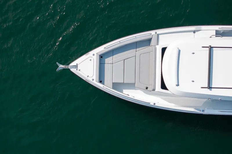 Slide: The Image of 2026 Cruisers Yachts 38 VTR helm with modern controls, overlooking scenic waterway. - 10