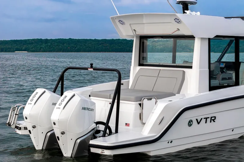 Slide: The Image of 2026 Cruisers Yachts 38 VTR on open water under sunny sky. - 18