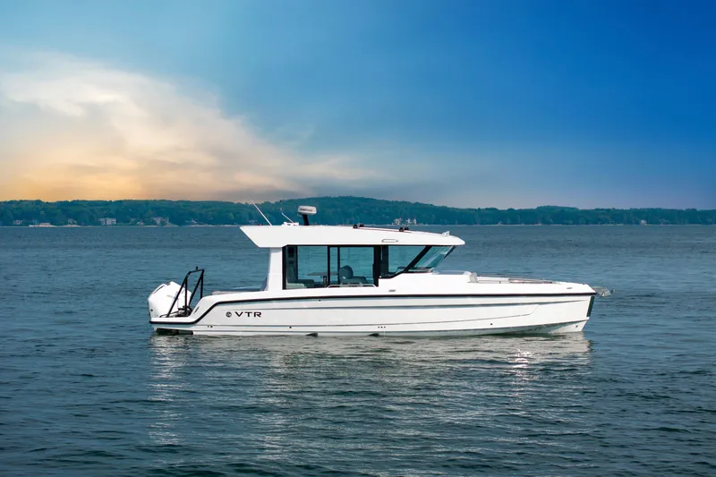 Slide: The Image of 2026 Cruisers Yachts 38 VTR on open water, featuring sleek design and modern amenities. - 2