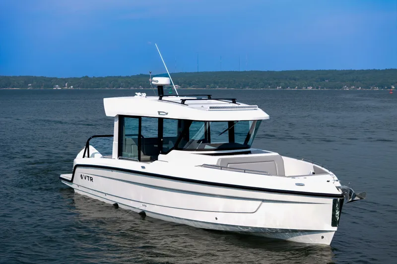 Slide: The Image of 2026 Cruisers Yachts 38 VTR luxury deck with sunbed, overlooking serene ocean view. - 3