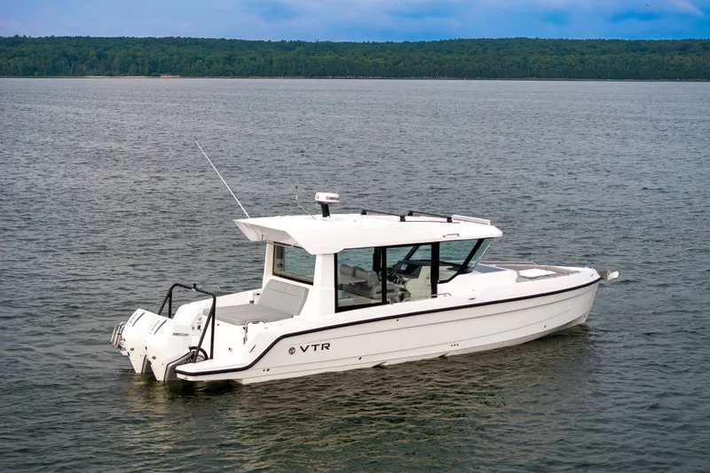 Slide: The Image of Luxurious interior of 2026 Cruisers Yachts 38 VTR with plush seating and scenic water view. - 7