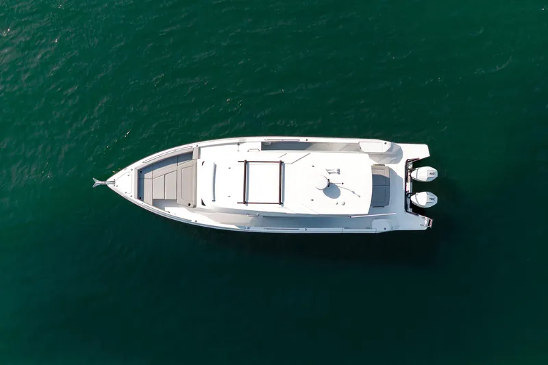 Slide: The Image of 2026 Cruisers Yachts 38 VTR helm with modern controls and scenic water view. - 9