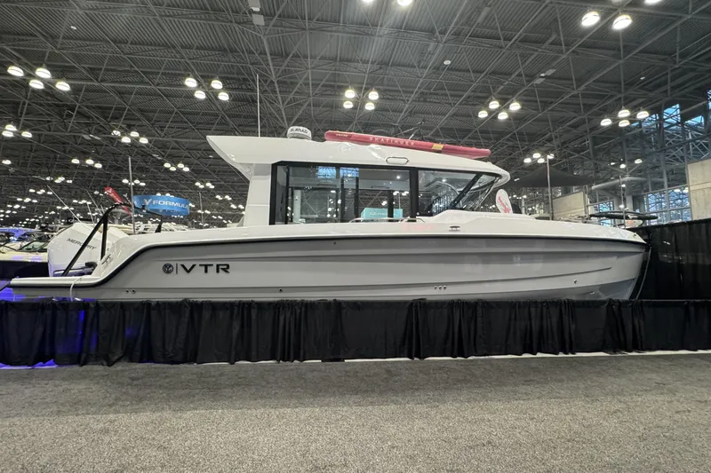 The Image of 2026 Cruisers Yachts 38 VTR displayed at a boat show, side view. - 0