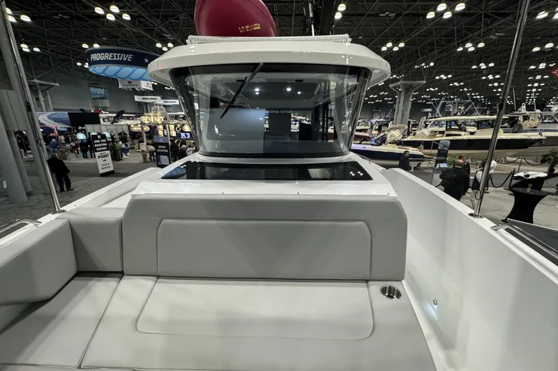 Slide: The Image of 2026 Cruisers Yachts 38 VTR showcased at a boat exhibition. - 21