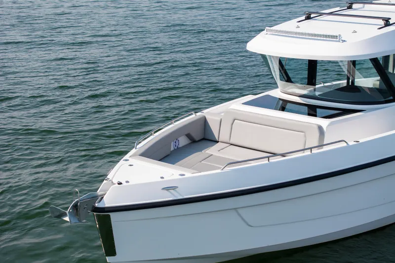 Slide: The Image of 2026 Cruisers Yachts 38 VTR displayed at a boat show, featuring sleek design and modern amenities. - 4