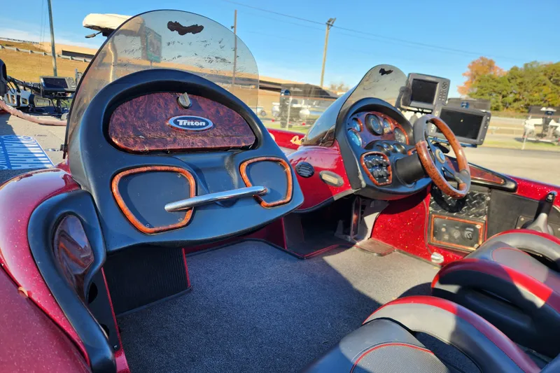 Slide: The Image of 2002 Triton Tr-20 ProDeck boat interior with dual consoles and steering wheel. - 12