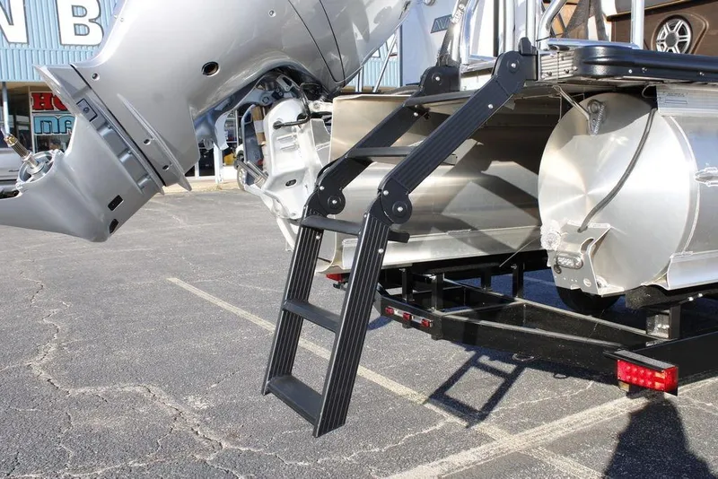 Slide: The Image of 2026 Avalon Catalina Quad Lounger 27 FT with motor and ladder detail. - 12