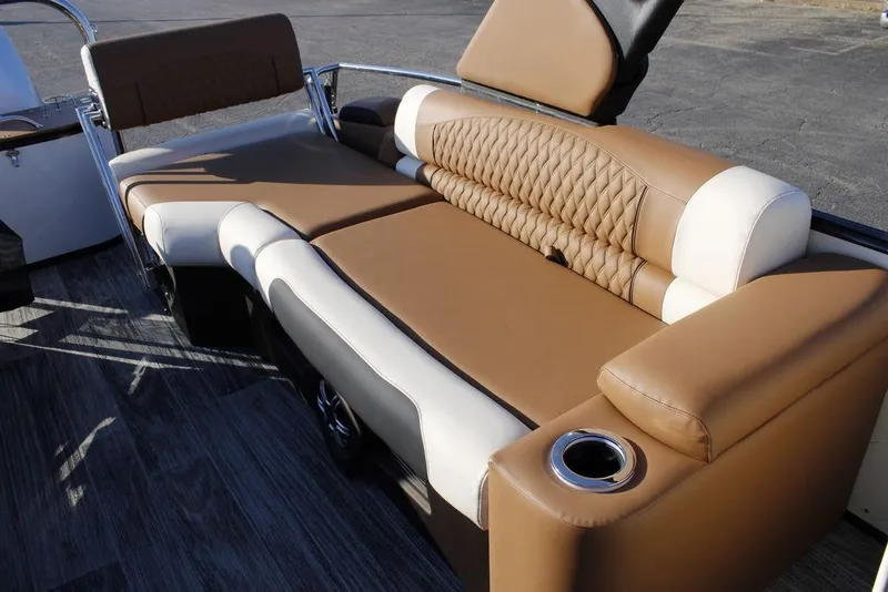 Slide: The Image of Luxurious seating on 2026 Avalon Catalina Quad Lounger 27 FT boat, featuring tan and white upholstery. - 16