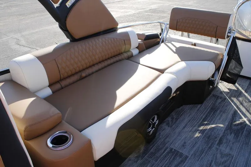 Slide: The Image of Luxurious seating on 2026 Avalon Catalina Quad Lounger 27 FT boat, featuring elegant brown and white upholstery. - 17