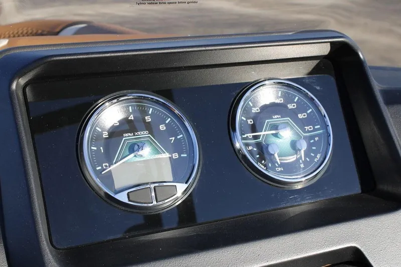 Slide: The Image of Dashboard of 2026 Avalon Catalina Quad Lounger 27 FT with RPM and speed gauges. - 27