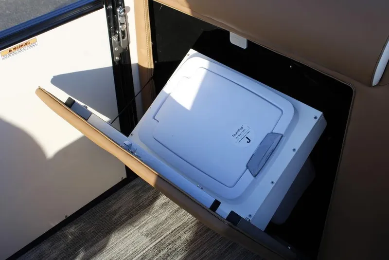 Slide: The Image of Storage compartment in 2026 Avalon Catalina Quad Lounger 27 FT boat. - 28