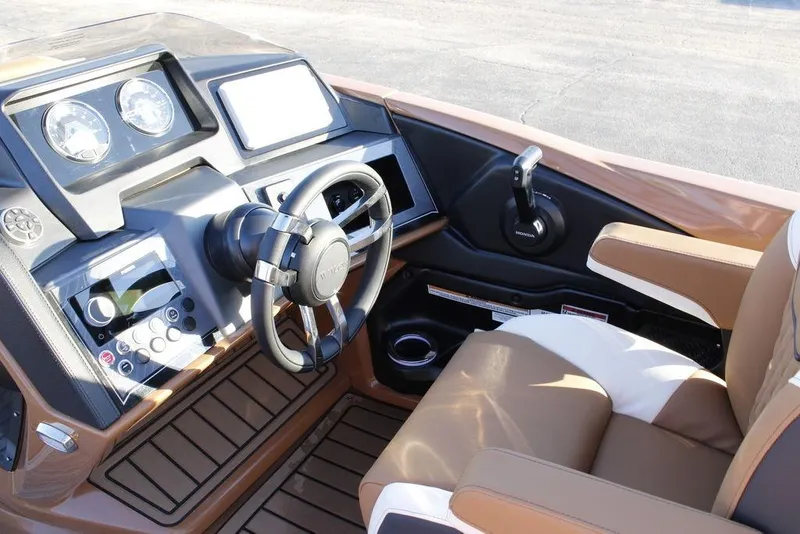 Slide: The Image of Interior of 2026 Avalon Catalina Quad Lounger 27 FT boat with modern dashboard and steering. - 29
