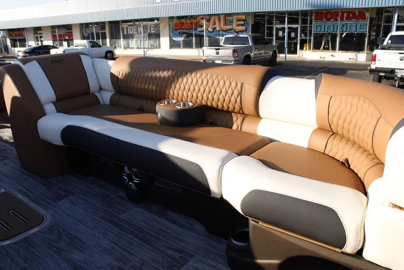 Slide: The Image of Luxurious seating on 2026 Avalon Catalina Quad Lounger 27 FT boat, featuring elegant brown and white upholstery. - 35