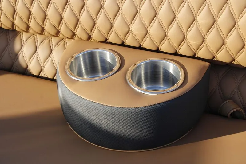 Slide: The Image of Luxurious tan leather seating with dual cup holders in Avalon Catalina Quad Lounger 2026. - 46