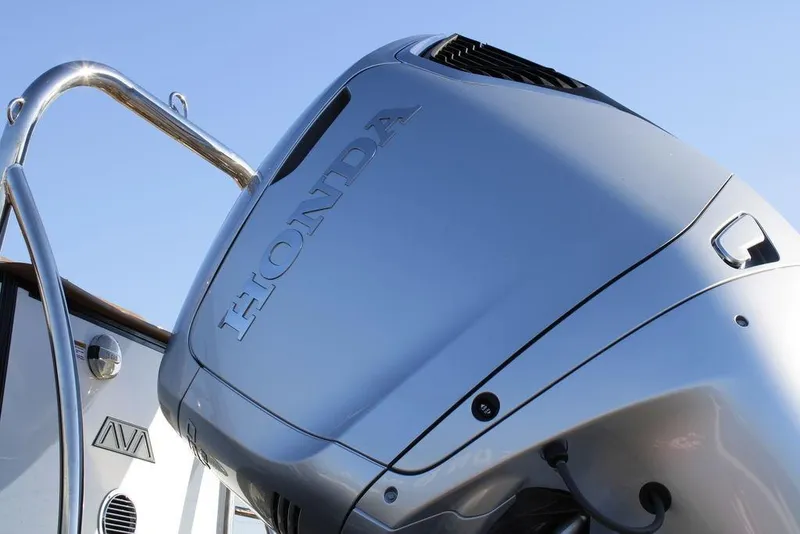 Slide: The Image of 2026 Avalon Catalina Quad Lounger 27 FT with Honda outboard motor, close-up view. - 9