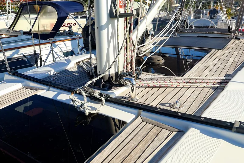 Slide: The Image of Deck of 2022 Hanse 388 sailboat with ropes and wooden finish. - 18