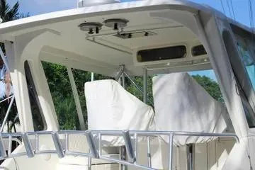 Slide: The Image of 1996 Ocean 53 Super Sport yacht with covered seating and sleek design. - 15