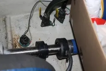 Slide: The Image of 1996 Ocean 53 Super Sport engine compartment with mechanical components and wiring. - 18