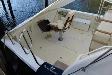 Slide: The Image of 1996 Ocean 53 Super Sport boat deck with seating and storage. - 19