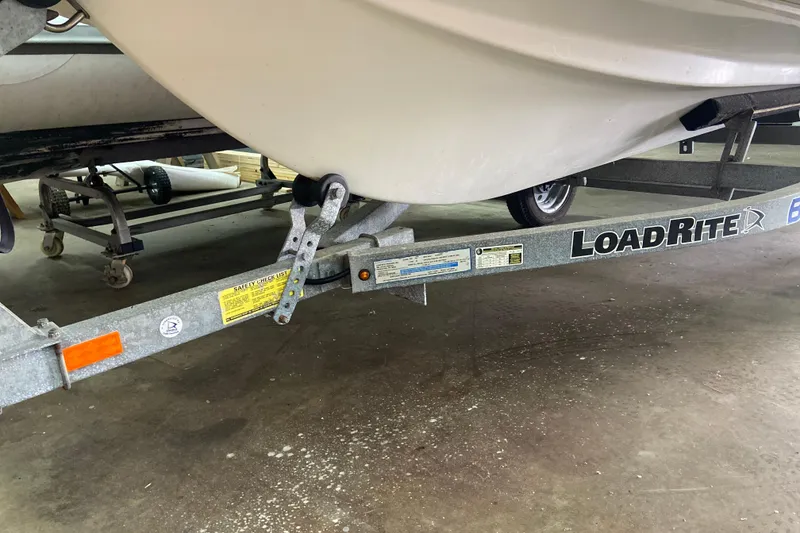 Slide: The Image of Walker Bay Generation 390 boat on Load Rite trailer, 2011 model, in a garage setting. - 6