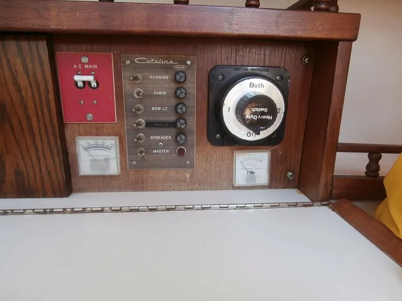 Slide: The Image of Electrical control panel of a 1978 Catalina 30 sailboat with switches and gauges. - 18