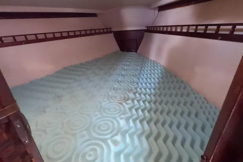 Slide: The Image of Interior of a 1978 Catalina 30 sailboat with foam mattress in the cabin. - 8