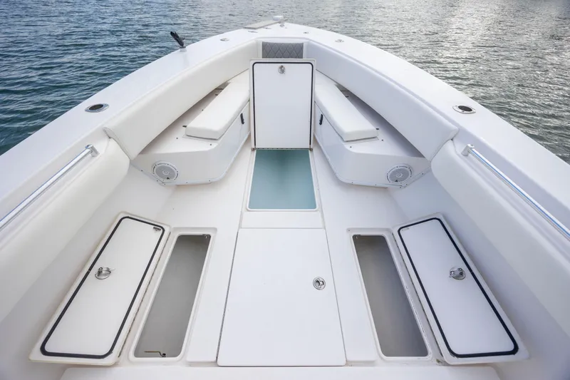 Slide: The Image of 2013 Contender 32 Tournament boat interior with storage compartments and seating. - 13
