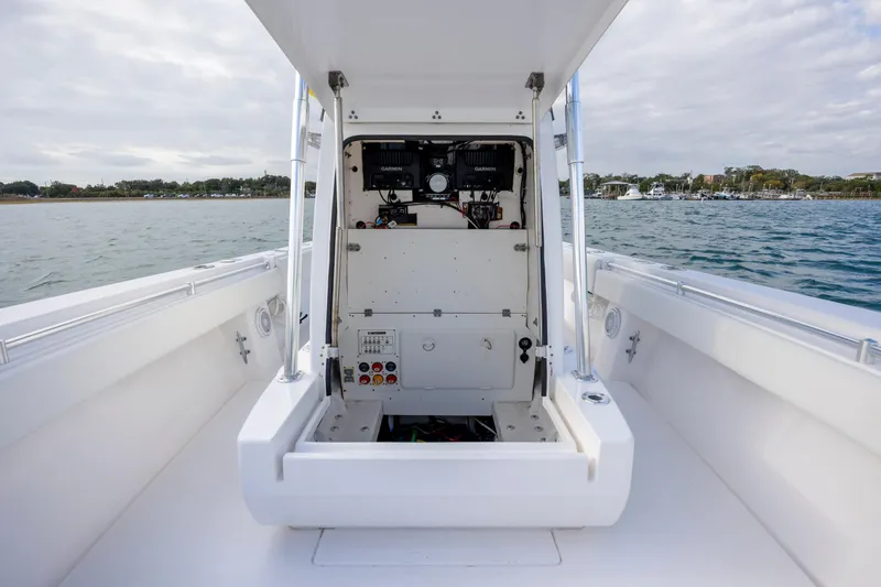 Slide: The Image of 2013 Contender 32 Tournament boat interior with open console, on calm water. - 16