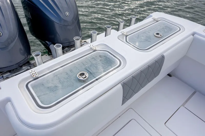 Slide: The Image of 2013 Contender 32 Tournament boat with dual engines and livewell on deck. - 29