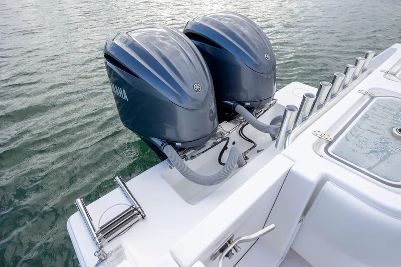 Slide: The Image of 2013 Contender 32 Tournament boat with dual Yamaha outboard engines on water. - 30