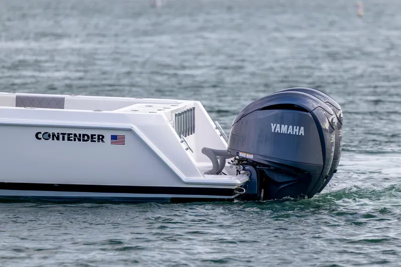 Slide: The Image of 2013 Contender 32 Tournament boat with Yamaha outboard engine on water. - 4
