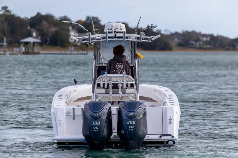 Slide: The Image of 2013 Contender 32 Tournament boat with dual Yamaha 300 engines on the water. - 6