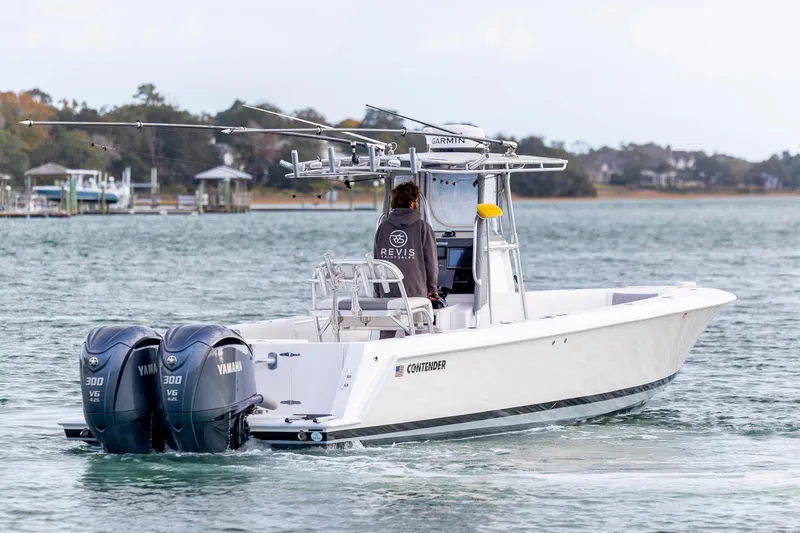 Slide: The Image of 2013 Contender 32 Tournament boat with dual Yamaha engines on the water. - 7