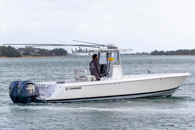 Slide: The Image of 2013 Contender 32 Tournament boat with dual Yamaha engines on the water. - 8