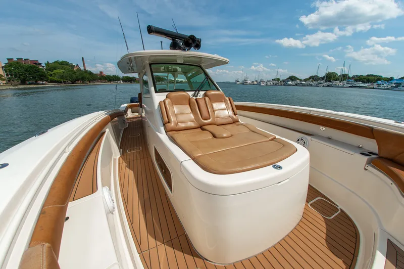 Slide: The Image of Scout 42LXF 2016: Luxurious deck with comfortable seating, anchored on calm waters. - 21