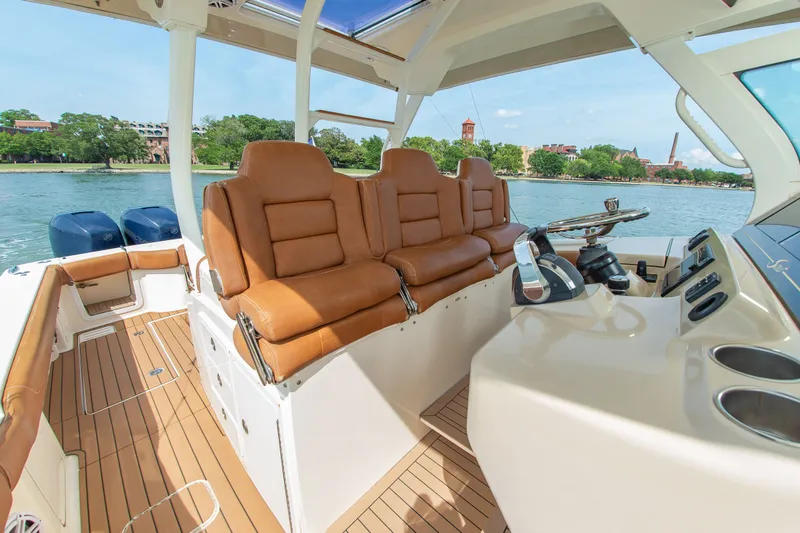 Slide: The Image of 2016 Scout 42LXF with brown leather seats and a modern helm station. - 28