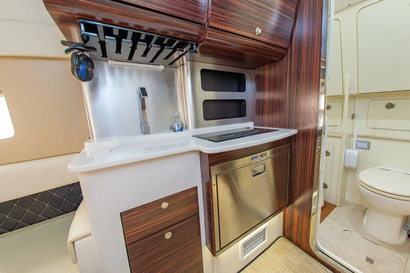 Slide: The Image of Interior of the 2016 Scout 42LXF featuring a modern kitchen and bathroom. - 33
