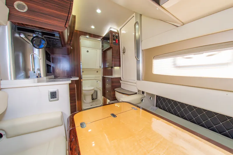 Slide: The Image of Interior of the 2016 Scout 42LXF with elegant wood finishes and modern kitchen. - 34