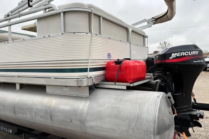 Slide: The Image of 2003 Smoker Craft Oasis pontoon boat with Mercury FourStroke engine and red fuel tank. - 4