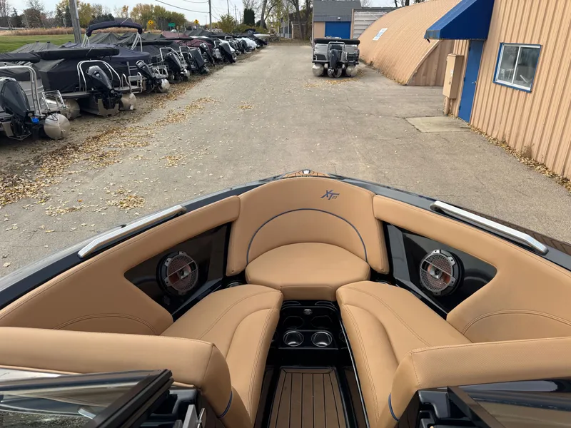 Slide: The Image of Interior of a 2021 MasterCraft XT23 boat with beige seating. - 15