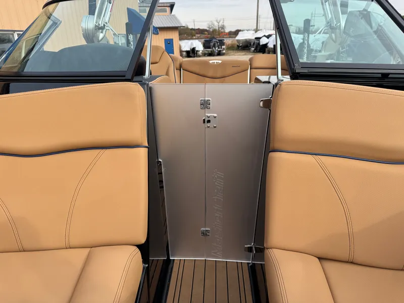 Slide: The Image of Interior of a 2021 MasterCraft XT23 boat with beige seats. - 17