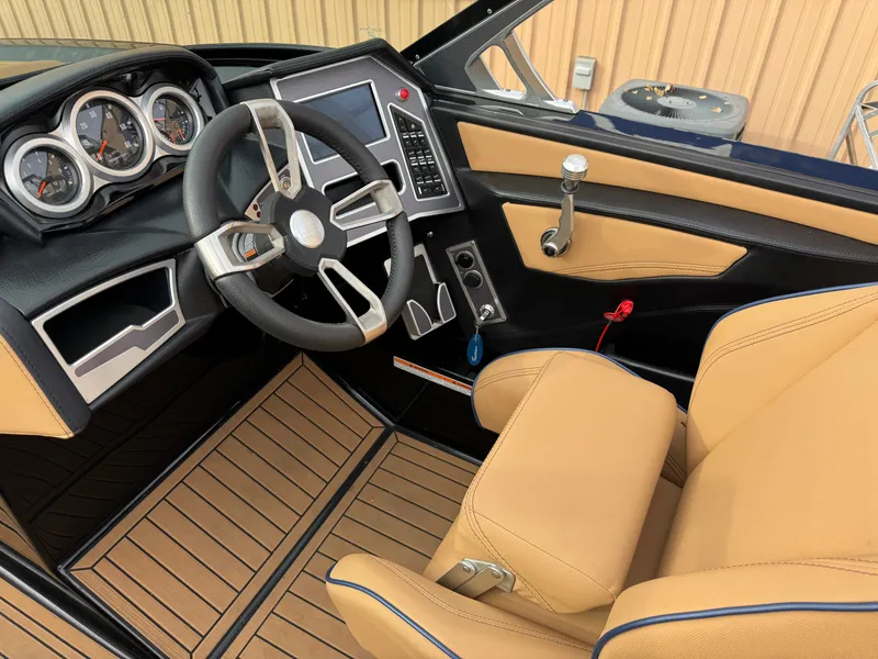 Slide: The Image of Interior of 2021 MasterCraft XT23 with steering wheel and dashboard. - 21