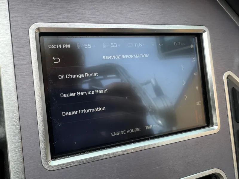 Slide: The Image of MasterCraft XT23 2021 display showing service information and engine hours. - 22