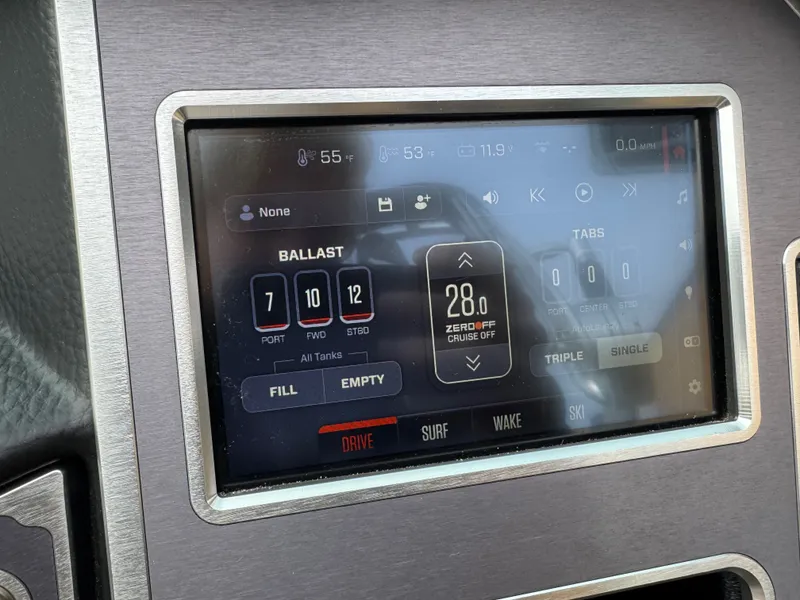 Slide: The Image of MasterCraft XT23 2021 boat control panel with ballast and tab settings. - 23