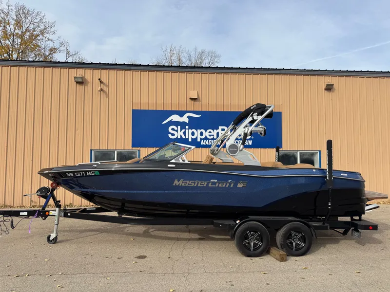 Slide: The Image of 2021 MasterCraft XT23 boat in front of SkipperBud building. - 26