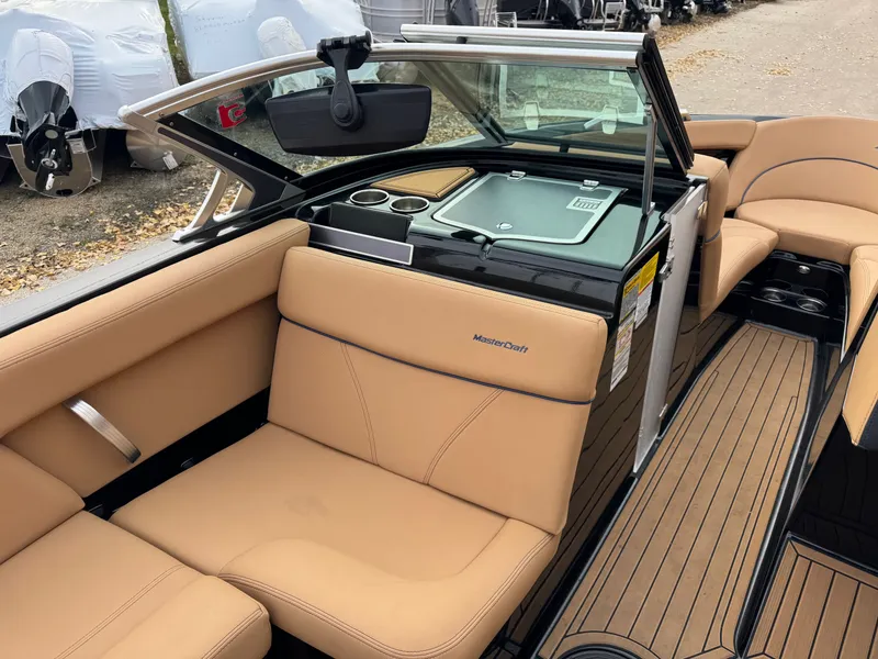 Slide: The Image of Interior of a 2021 MasterCraft XT23 boat with beige seating. - 8
