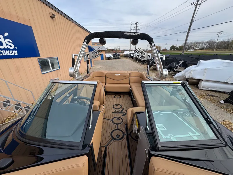 Slide: The Image of 2021 MasterCraft XT23 boat with luxurious interior and modern design. - 9