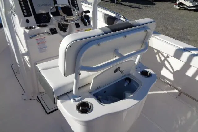 Slide: The Image of 2026 Robalo R222 Center Console boat interior with helm and seating area. - 17